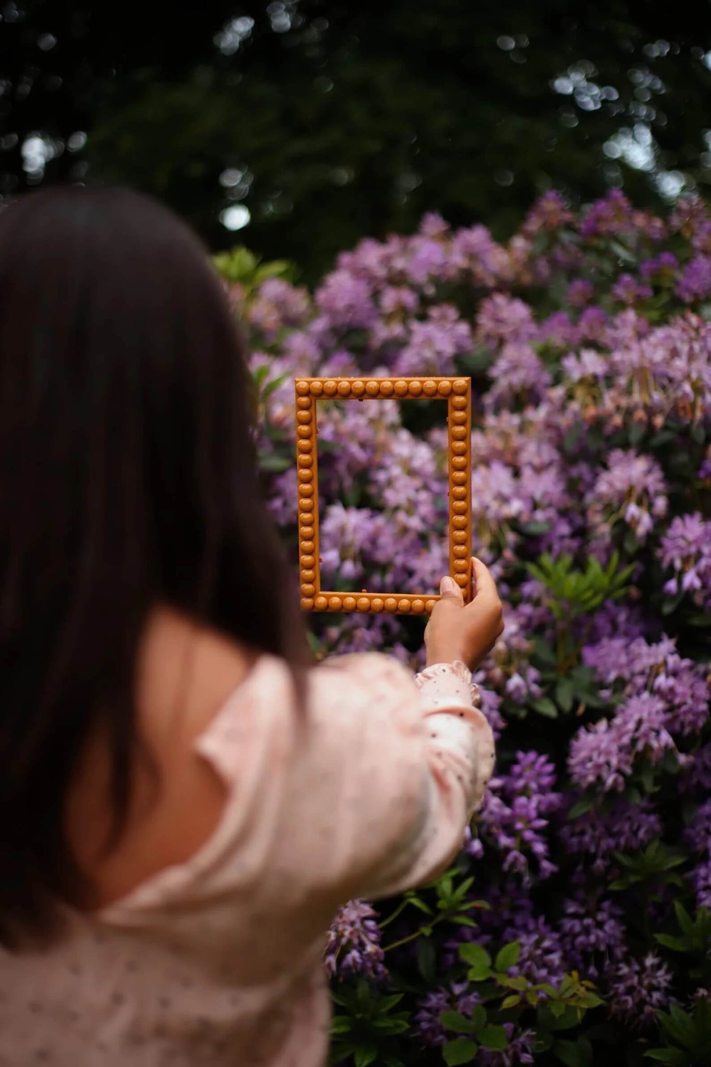 Hand holding Mustard Bobbin Frame
