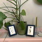 Two Inky Blue Bobbin Frames on a countertop 